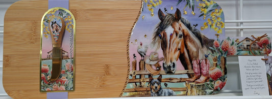 Decorative cutting boards with horse-themed designs on a shelf.