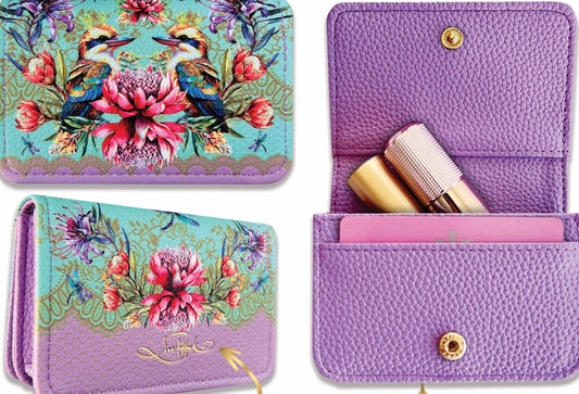 Floral-patterned wallet with gold detailing on a decorative background