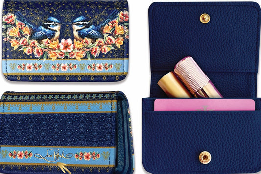 Navy blue cardholder with floral design and gold accents on a decorative background