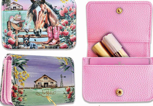 Pink wallet with floral design and gold accents on a colorful background