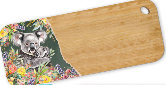 Bamboo serving platter with koala design on a floral background